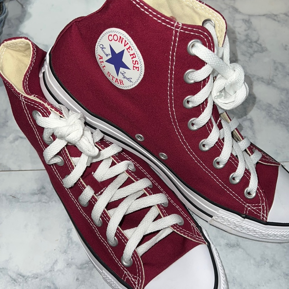 New burgundy high top converse .
